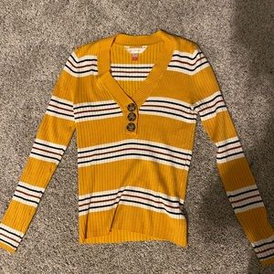 Yellow, white, black, and maroon long sleeve.